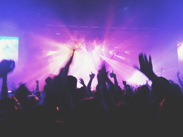 Concert crowd with purple stage lights